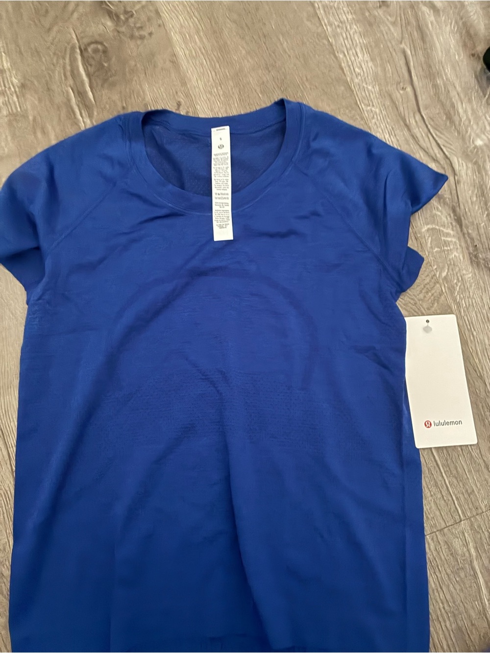 lululemon athletica Women's Short Sleeve Crew Tee - Royal Blue and a black one.